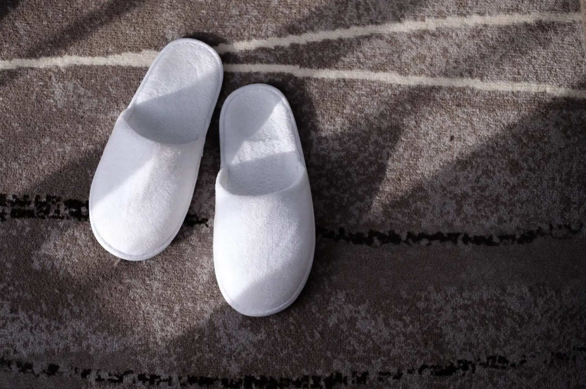 Detailed shot of a semi-automatic espresso coffee machine pouring dark coffee into a glass cup with thick crema in China