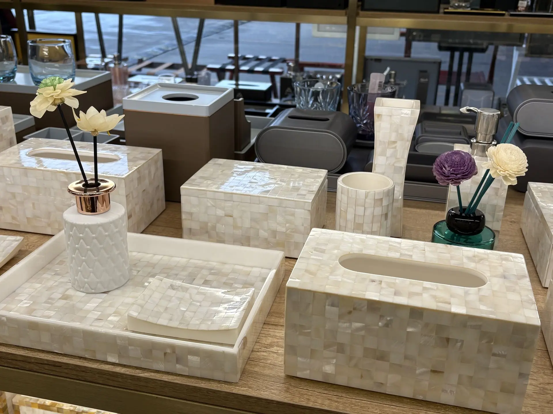 Luxury bathroom vanity set including a tissue box cover and flower vase made of cream resin with decorative mother-of-pearl shell inlays.