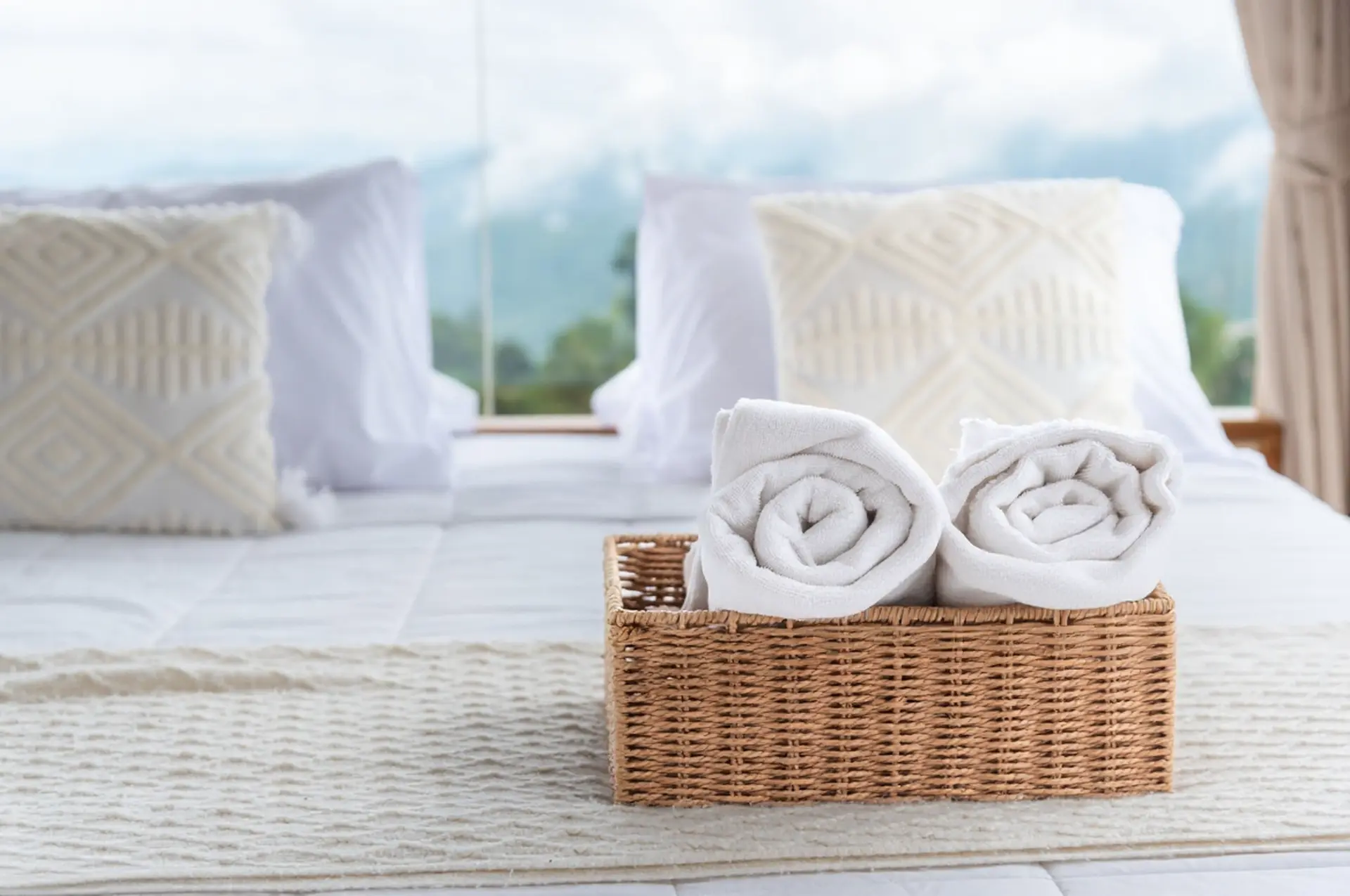 High-quality hotel linens: Planning for holiday demand and supply chain lead times High-quality hotel linens and towels in a luxury suite, highlighting the importance of planning for holiday peak season lead times.
