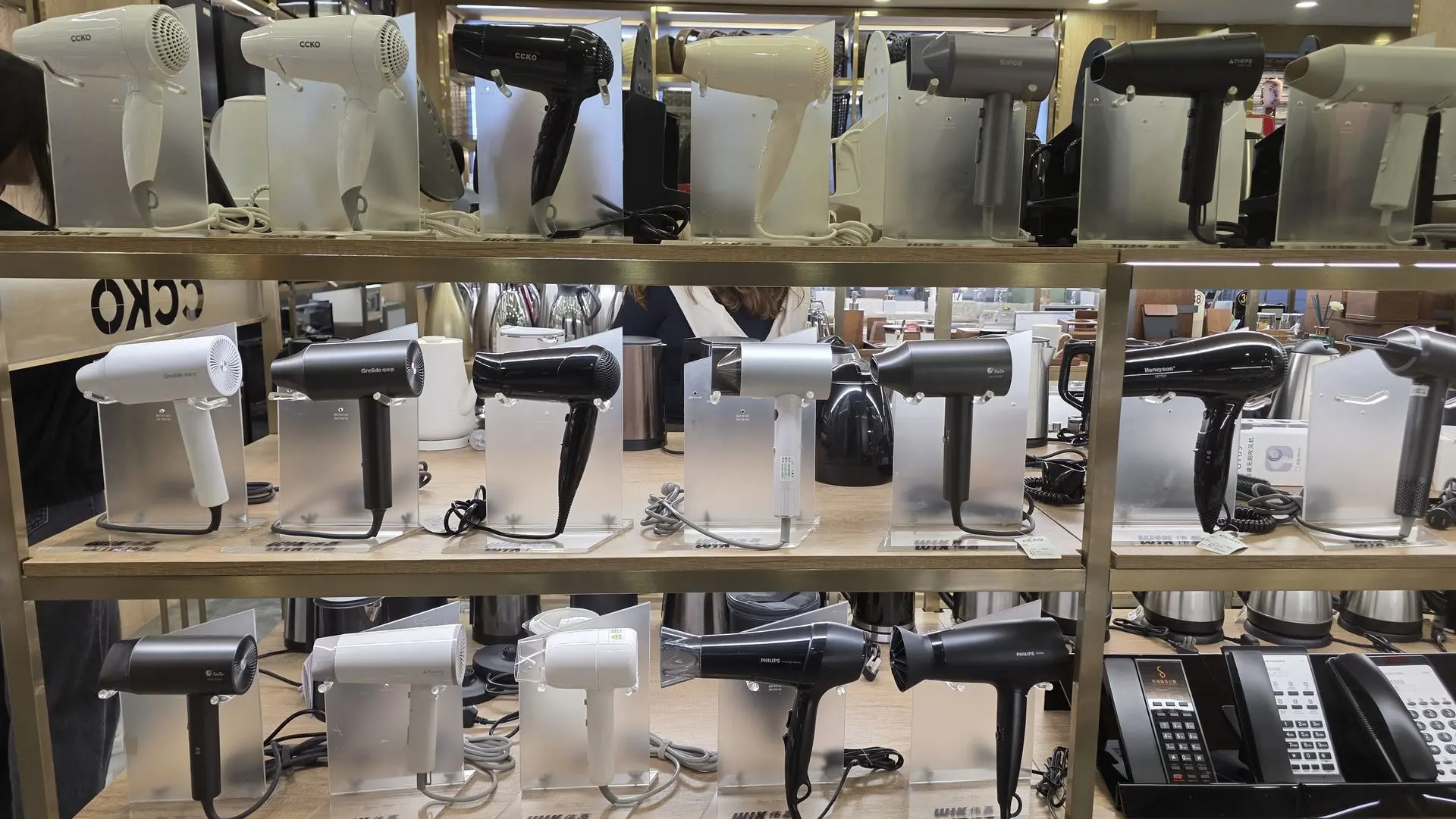 China OS&E Hotel Guest Room Hair Dryer Collection Display of professional hair dryers from a China OS&E supplier, showcasing various models and colors for hotel guest rooms.