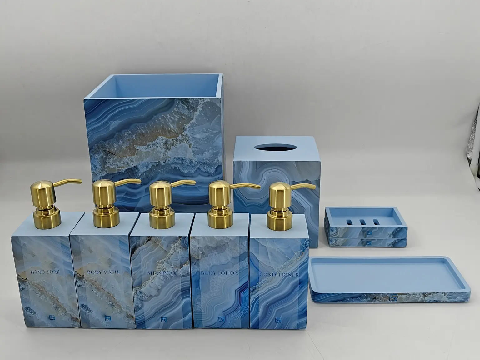 Luxury blue marble agate bathroom accessory set with gold pumps, high-quality bath decor manufactured in China.