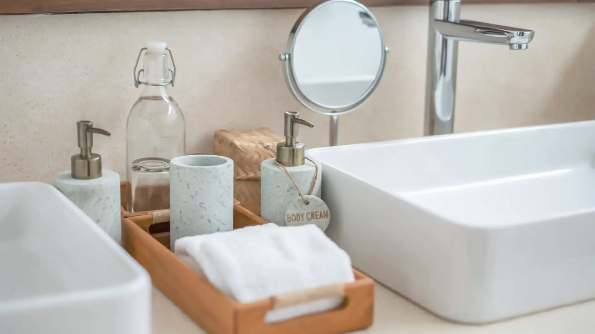 Luxury marble effect bathroom OS&E accessory set from China supplier featuring soap dispensers and wooden tray.