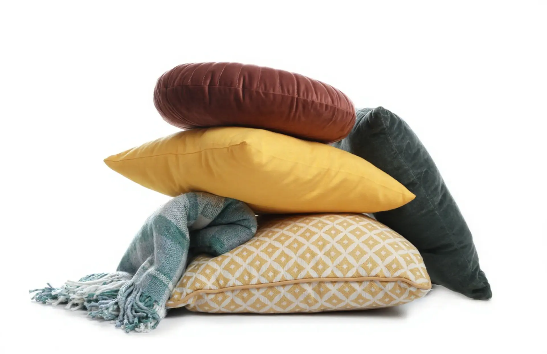 Contemporary China Decor-English Inspired Throw Pillow and Blanket Collection A decorative stack of home textiles including a round rust velvet cushion, a yellow throw pillow, a patterned gold cushion, and a teal blanket, representing China Decor-English interior styling.