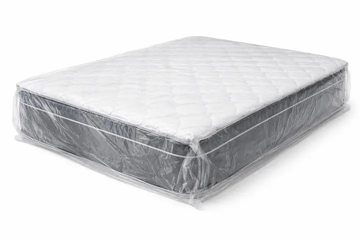 Factory-wrapped commercial mattress from China in protective plastic packaging for international export and hospitality transport.