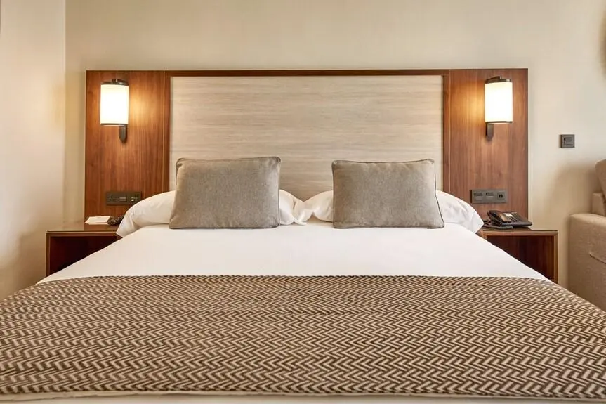 Contemporary Wooden Chinese Headboard with Sconce Lighting Contemporary wooden Chinese headboard with built-in wall sconces and side nightstands