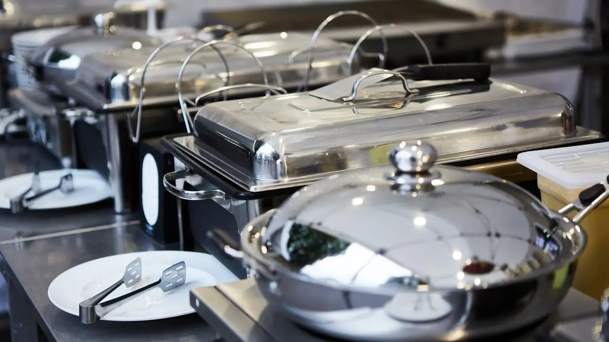 Stainless Steel Buffet Equipment China Polished stainless steel chafing dishes and soup warmers serving as commercial buffet equipment China in a professional hospitality setup.