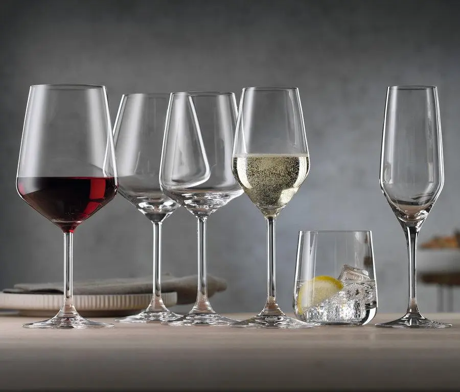 An assortment of crystal wine glasses, champagne flutes, and a tumbler showcasing professional hotel glassware China